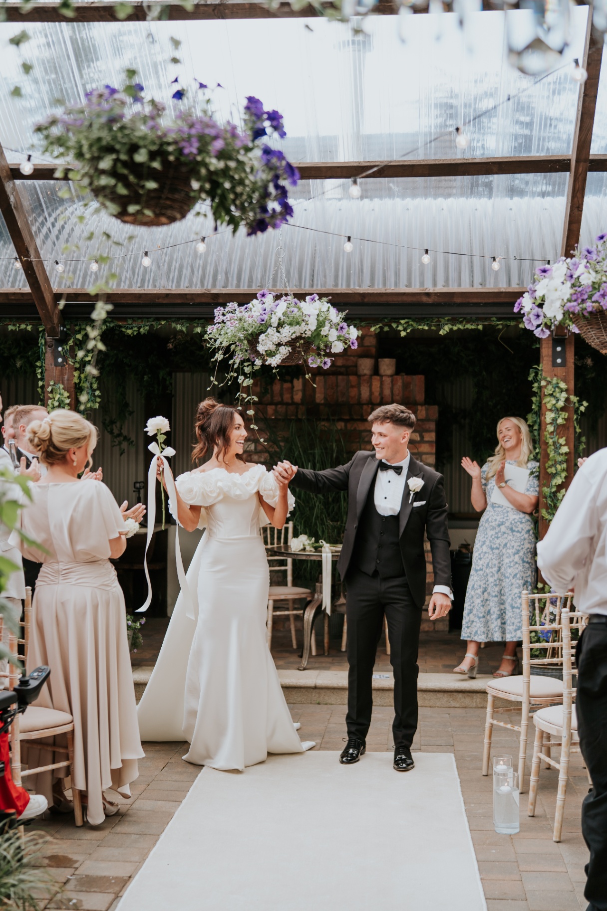 The couple beginning their walk back down the aisle