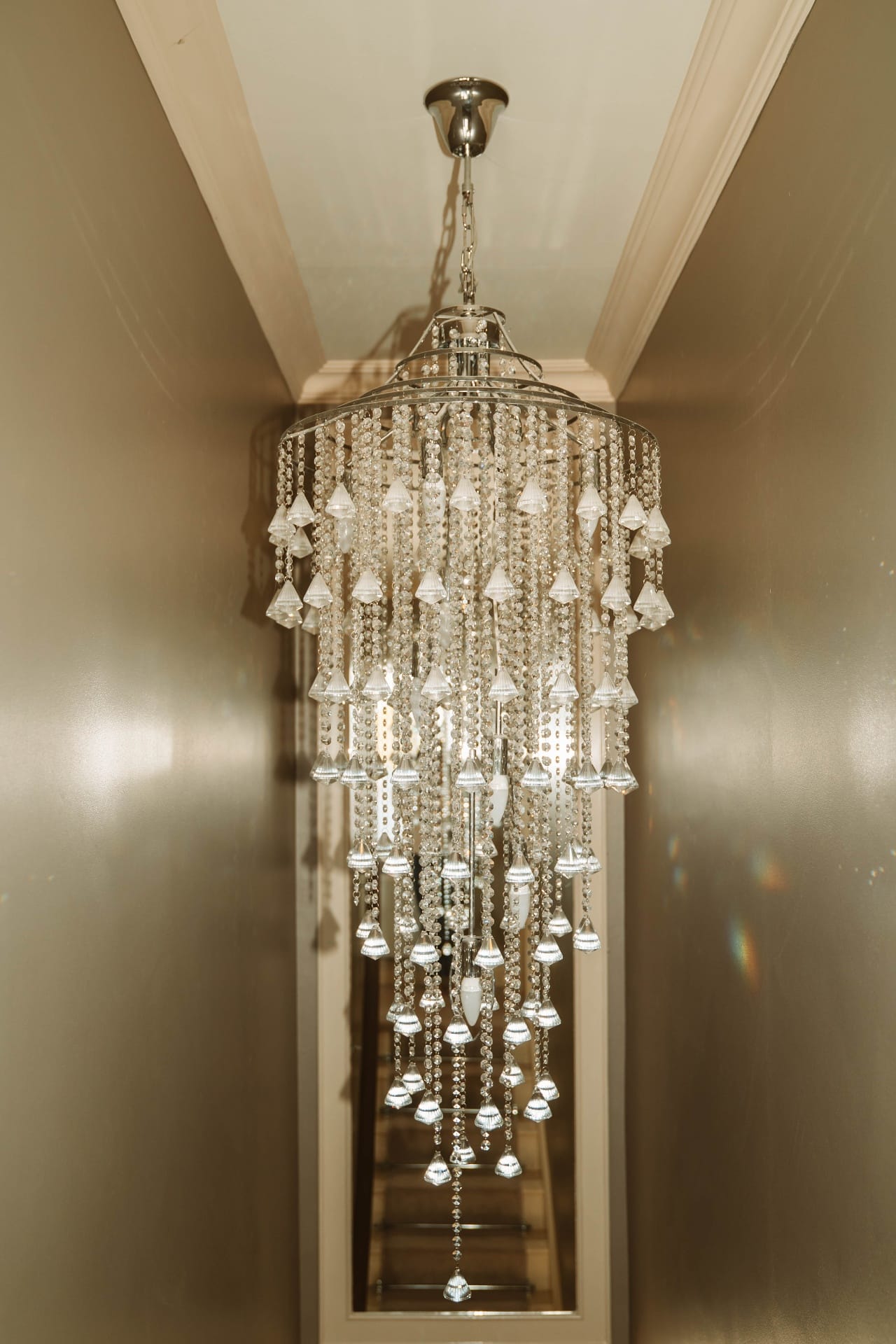 Crystal chandelier above the Farmhouse stairwell