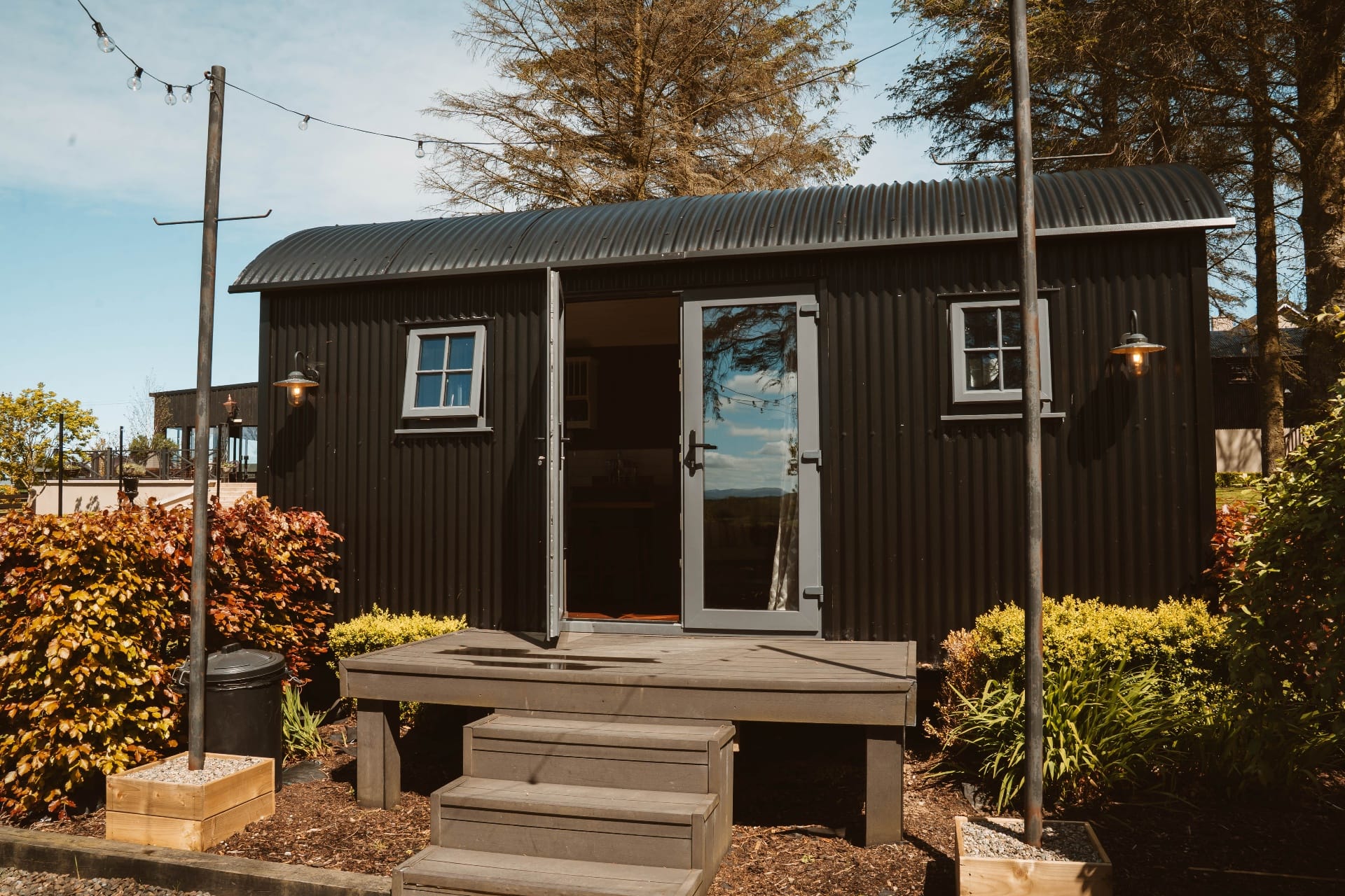 Shepherd's Hut exterior with corrugated roof and decking
