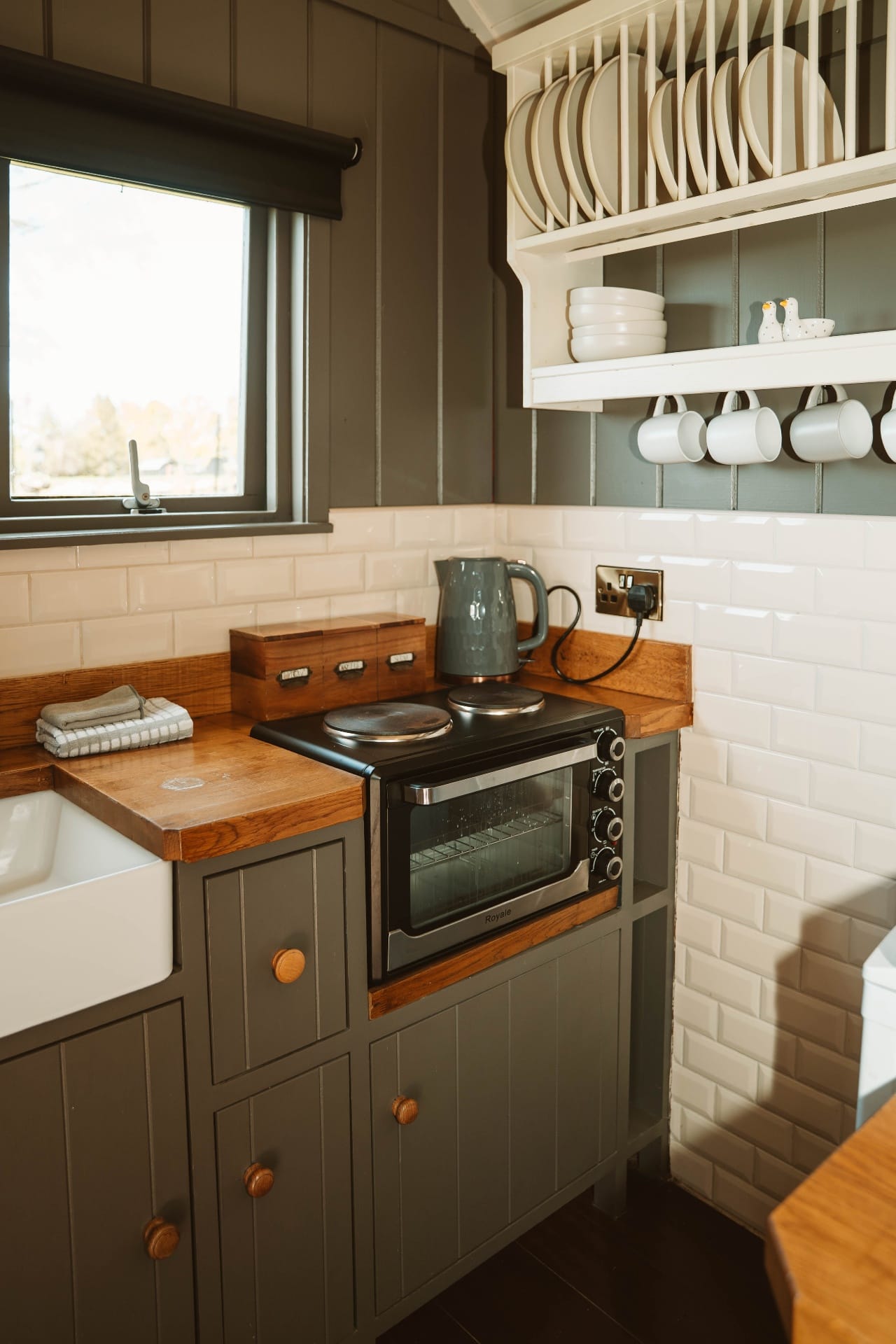 Shepherd's Hut kitchenette with oven and open shelving