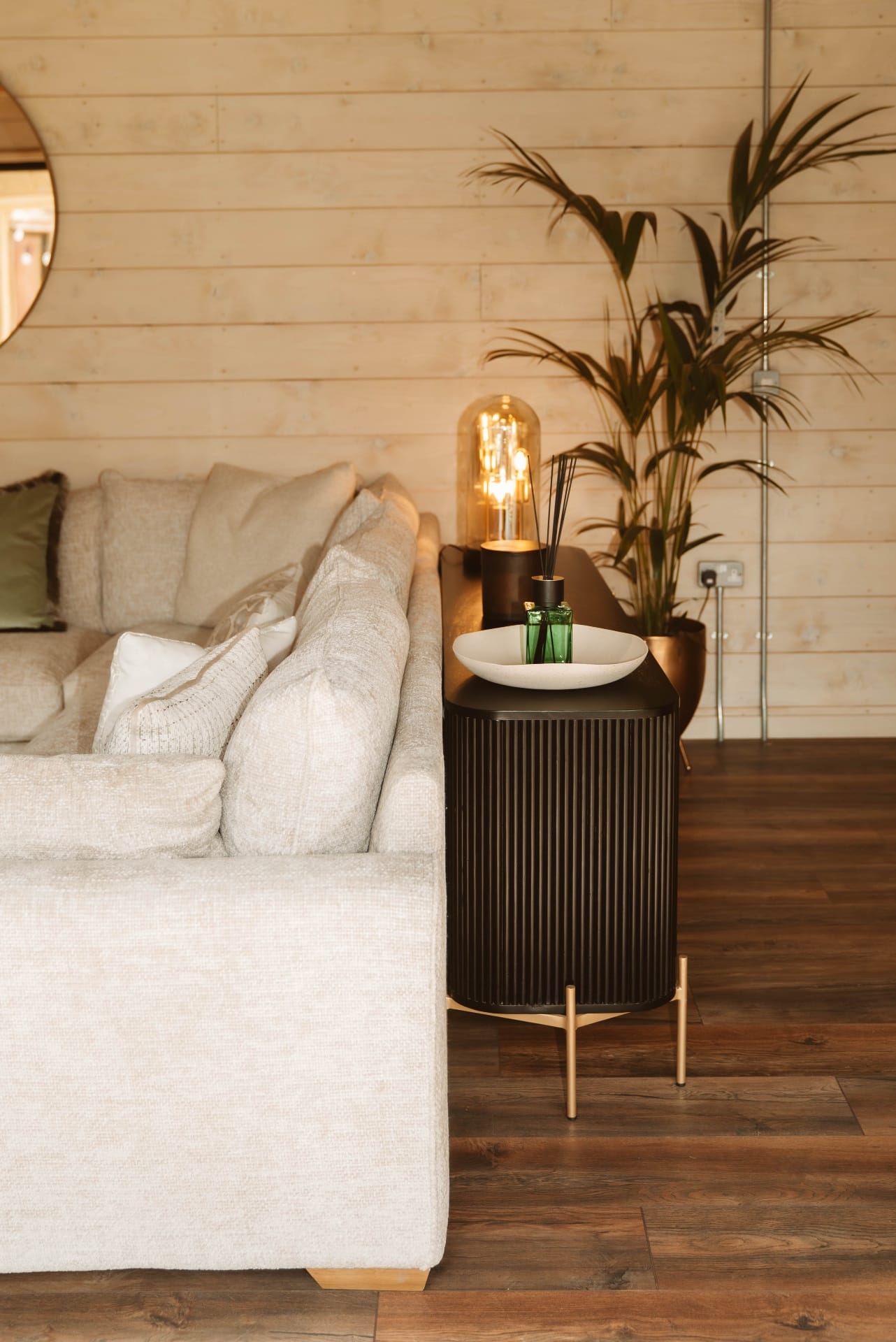 Treehouse Lookout sideboard styling beside the lounge sofa and indoor plant