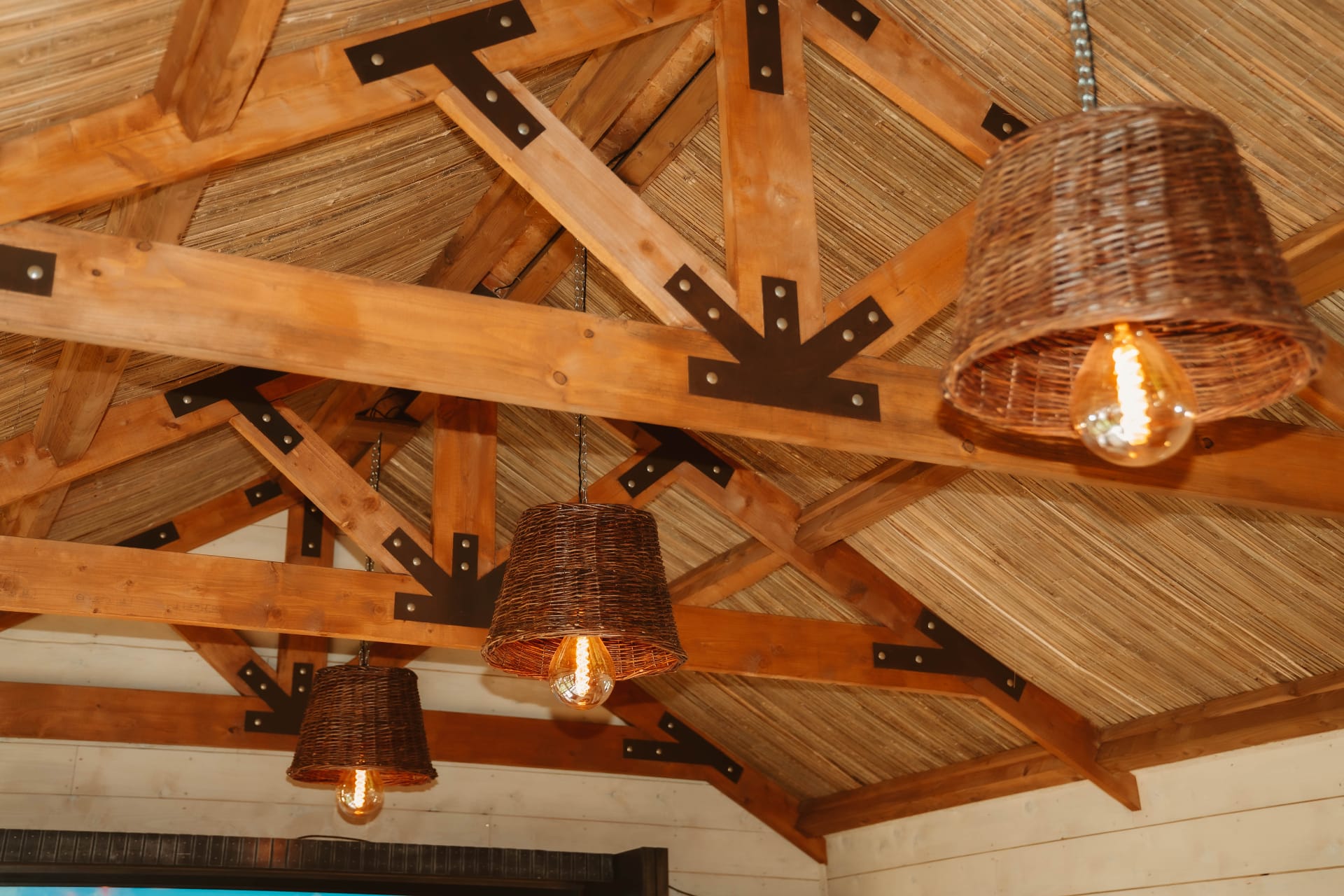 Treehouse Lookout vaulted timber ceiling with hanging wicker pendants