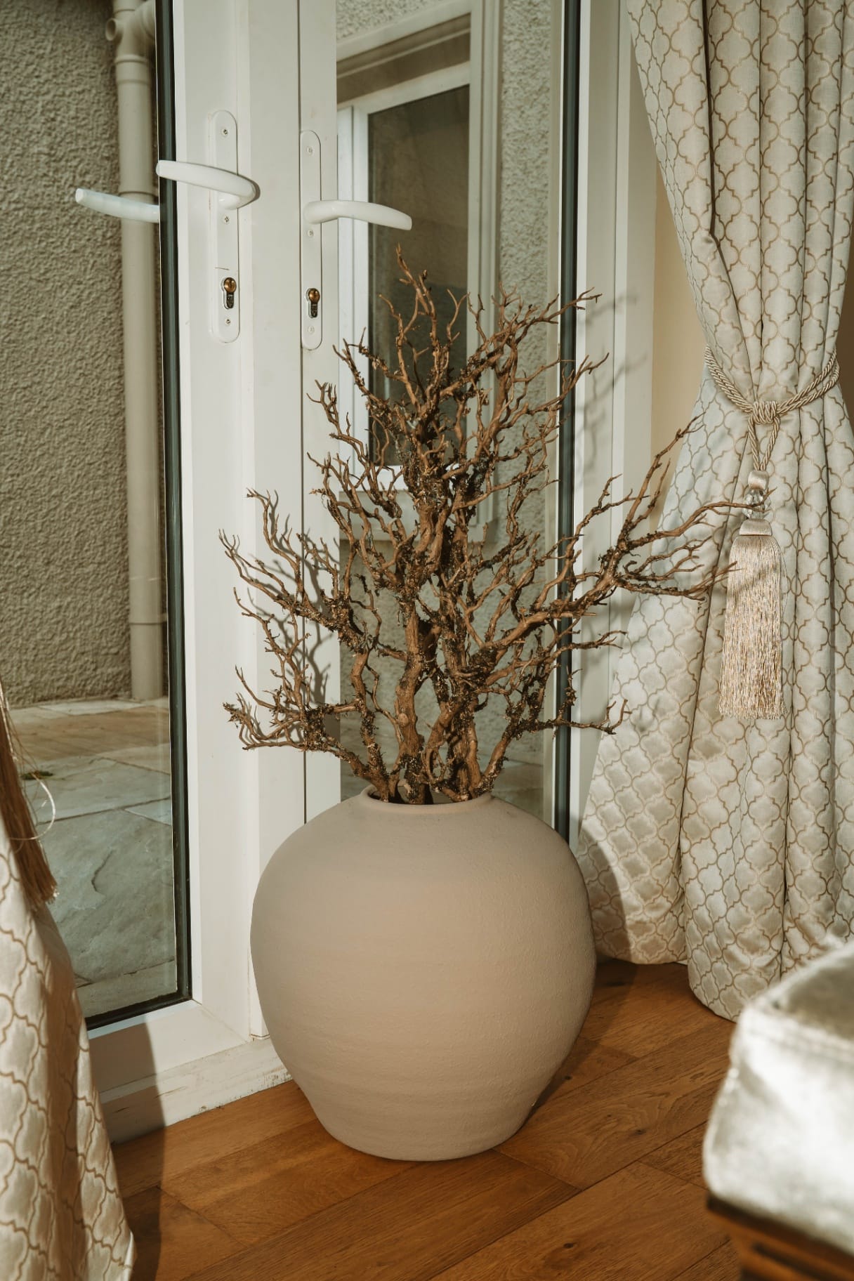 Farmhouse decorative vase by the patio doors