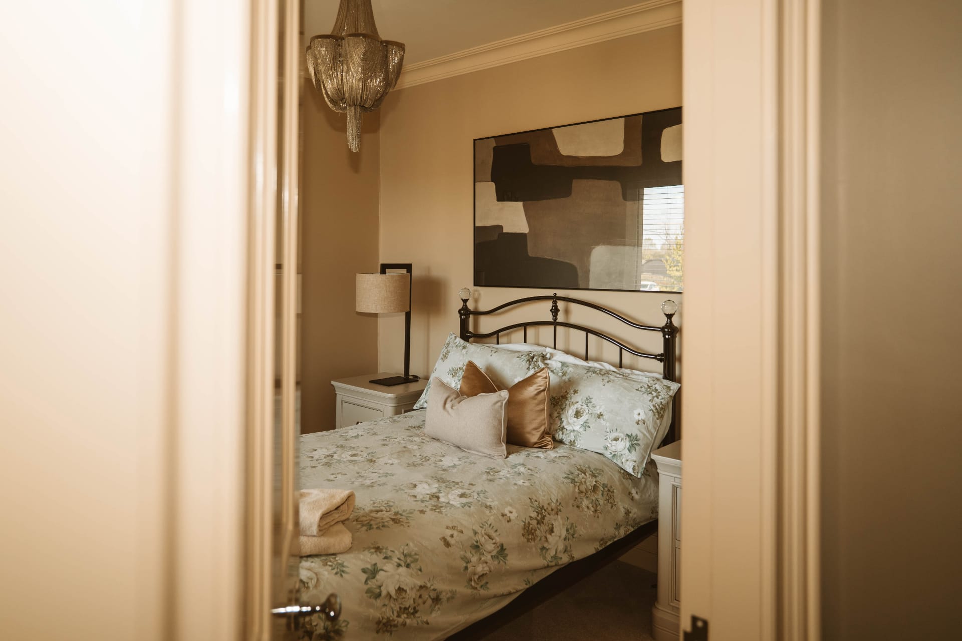 Farmhouse guest bedroom seen through the doorway