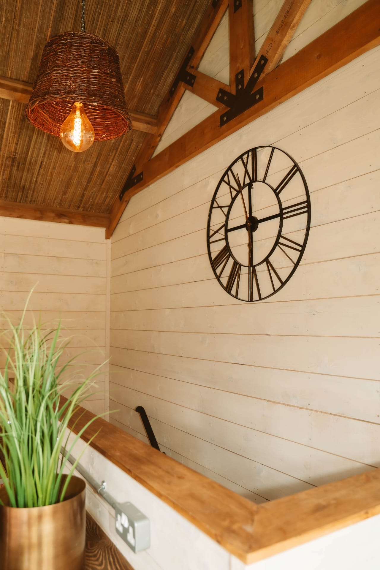 Treehouse Lookout mezzanine detail with wicker pendant and wall clock
