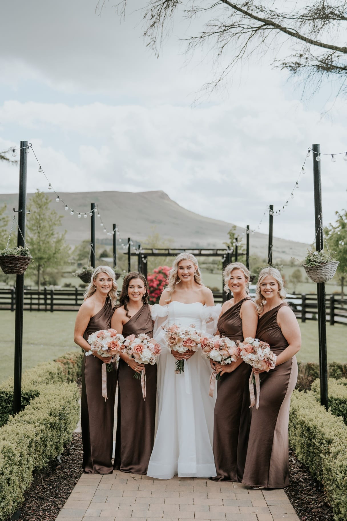 Bride with bridesmaids on the Ballyness boardwalk with mountain backdrop