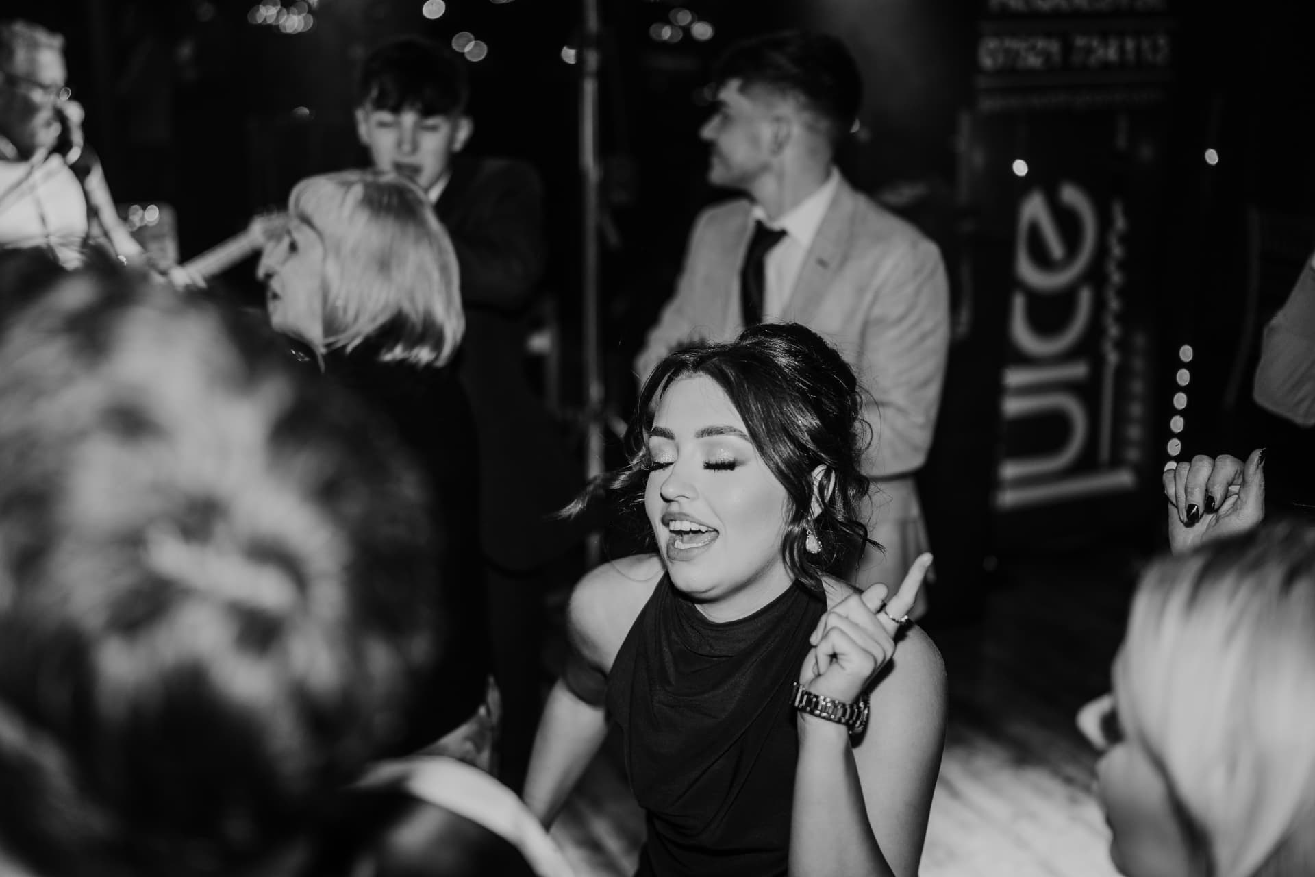 Black and white photograph of a guest lost in the music