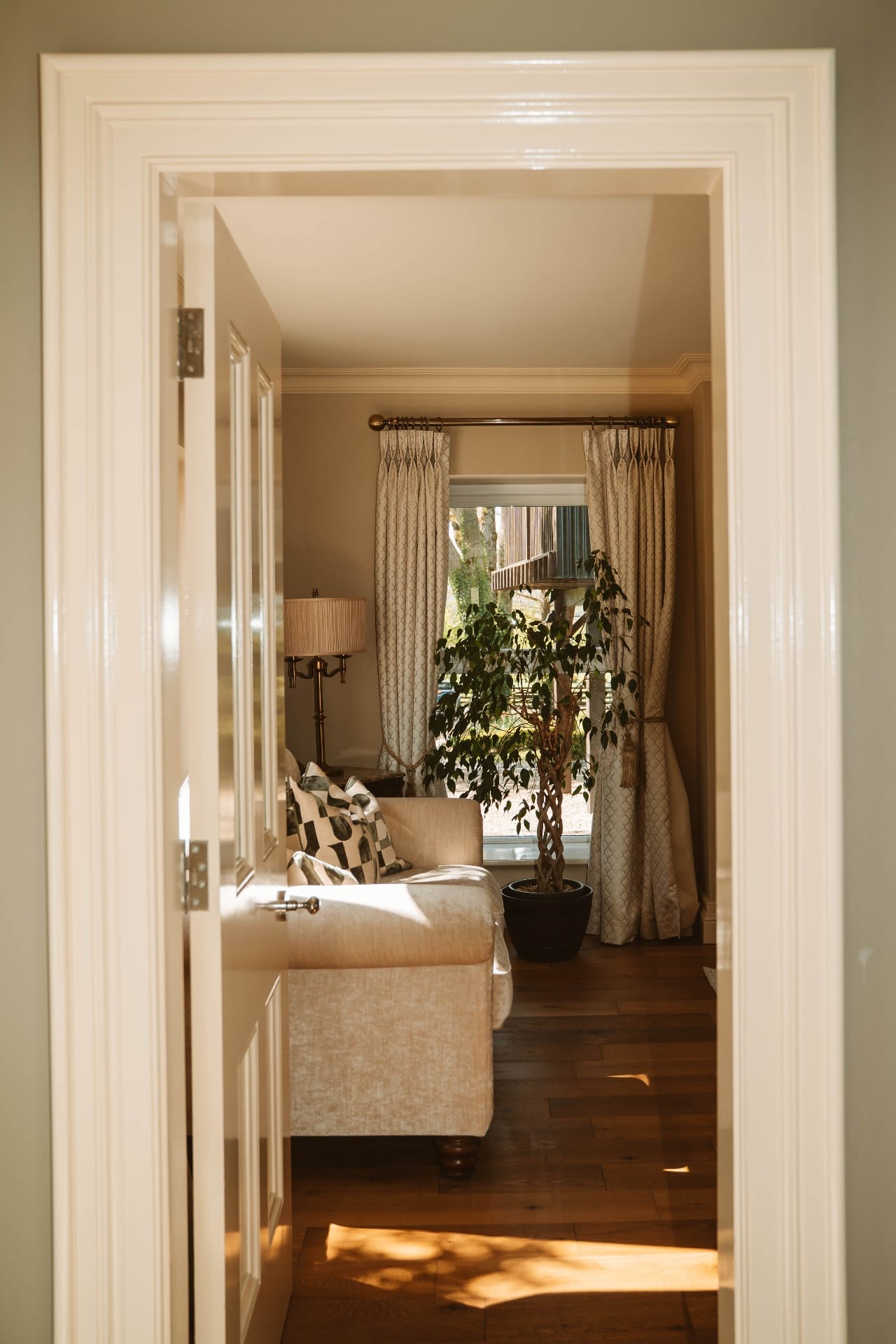 Farmhouse sitting room view through doorway