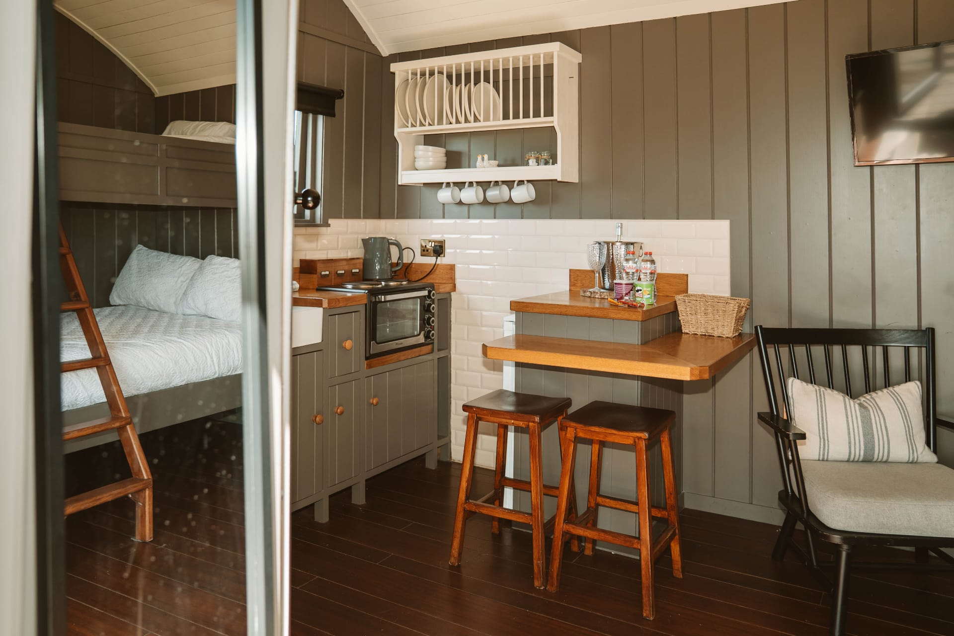 Shepherd's Hut kitchen and bunk bedroom interior