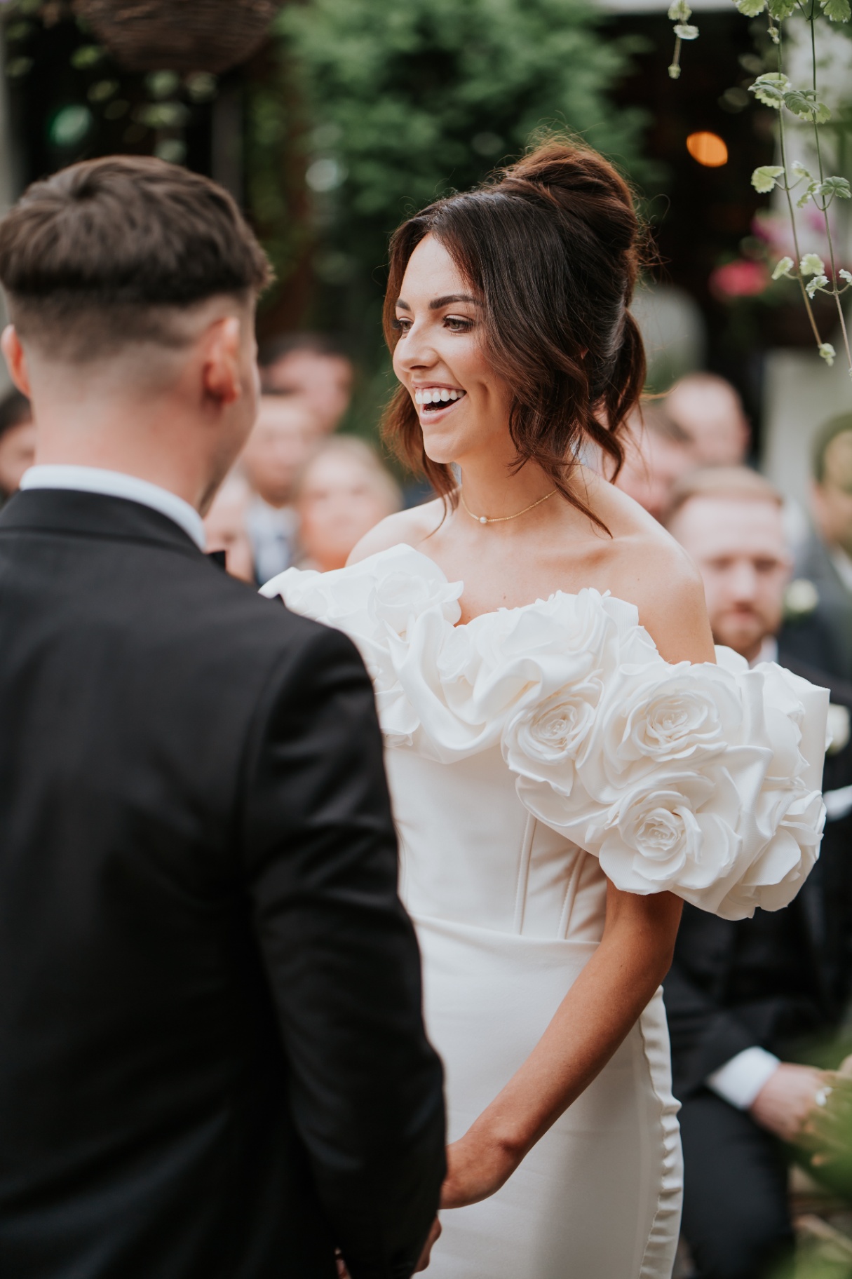 Bride smiling during the exchange of vows