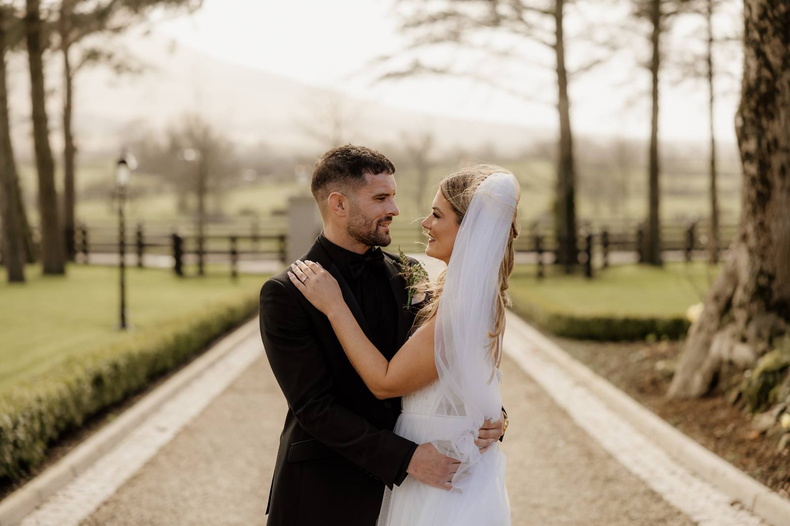 Bride and groom sharing a quiet moment on the Ballyness driveway