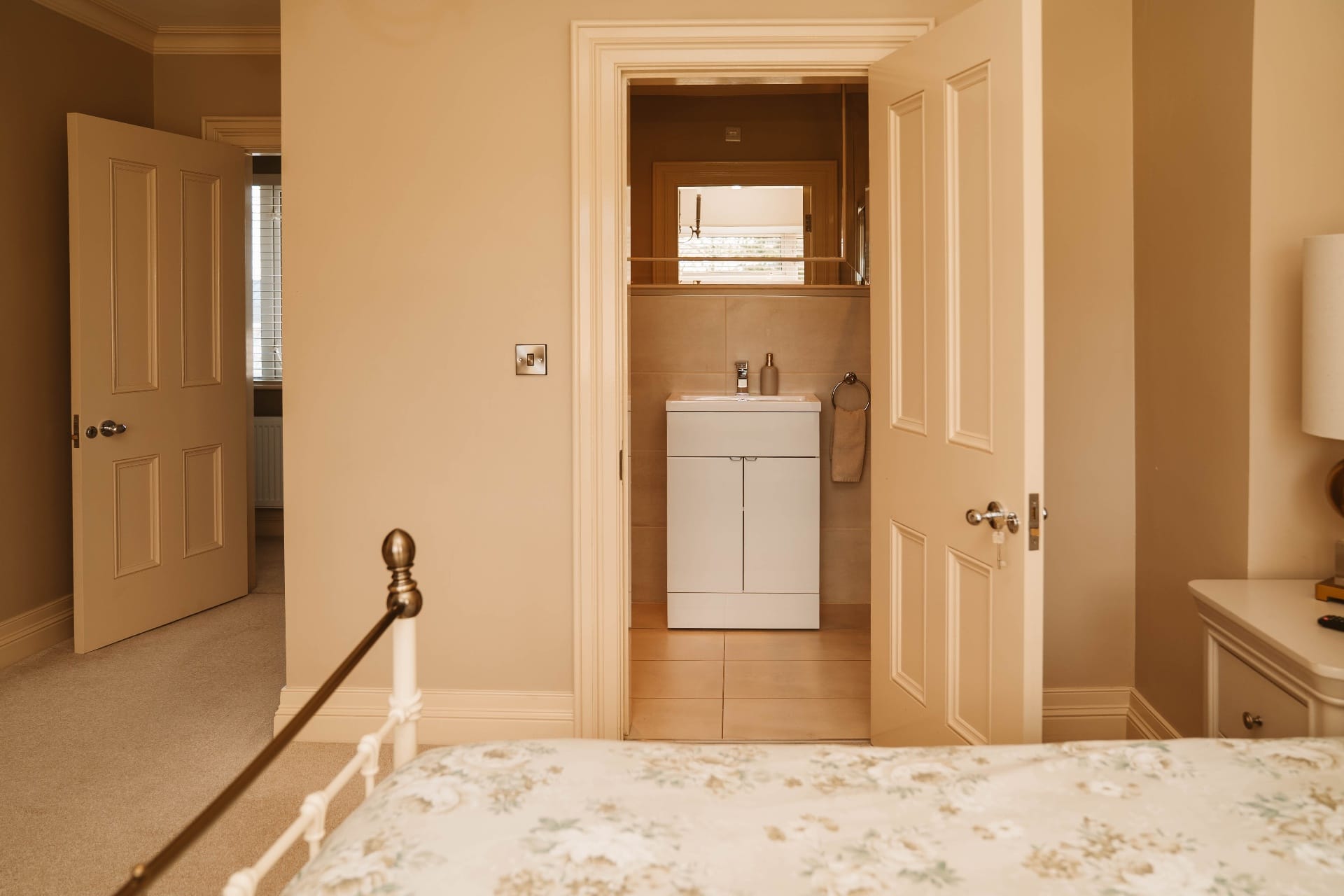 Farmhouse bedroom view toward the ensuite bathroom