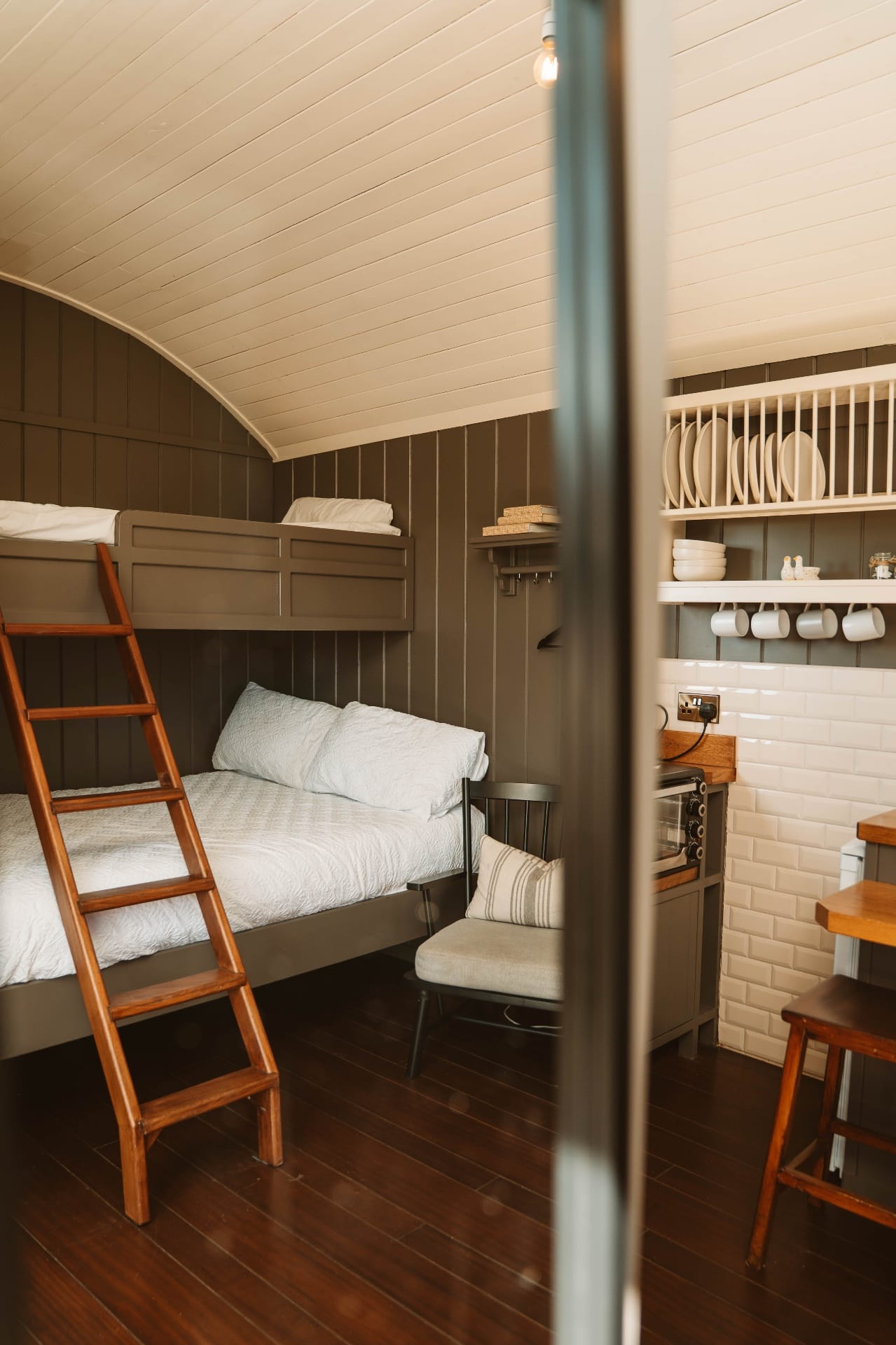 Shepherd's Hut bunk beds and kitchenette