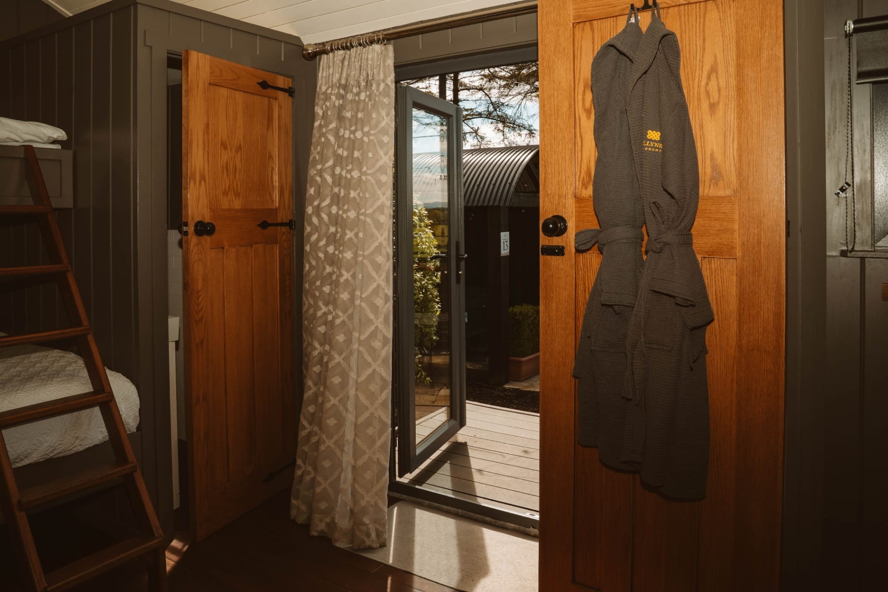 Shepherd's Hut interior with robes and open door
