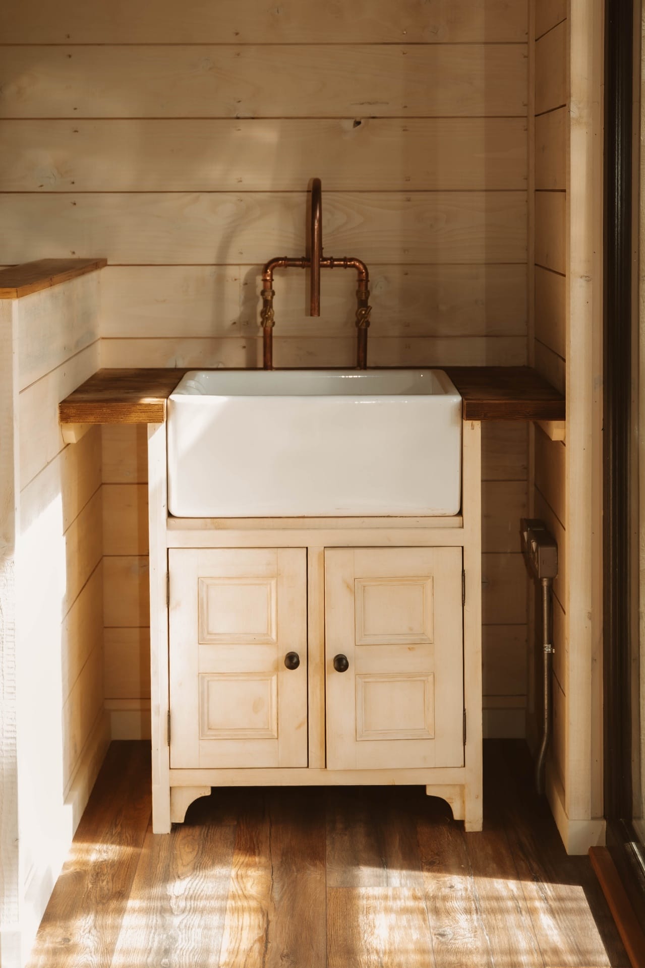 Treehouse Lookout Belfast sink with copper tap and timber worktops