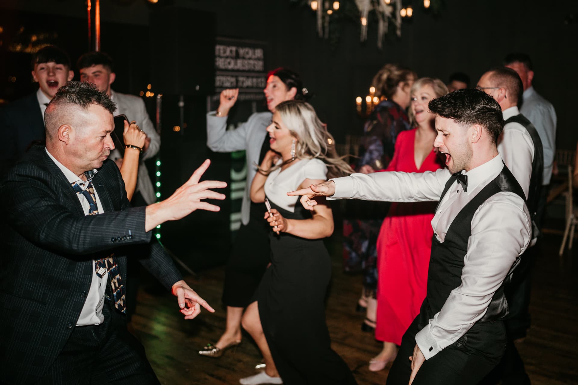 Two guests facing off on the dance floor