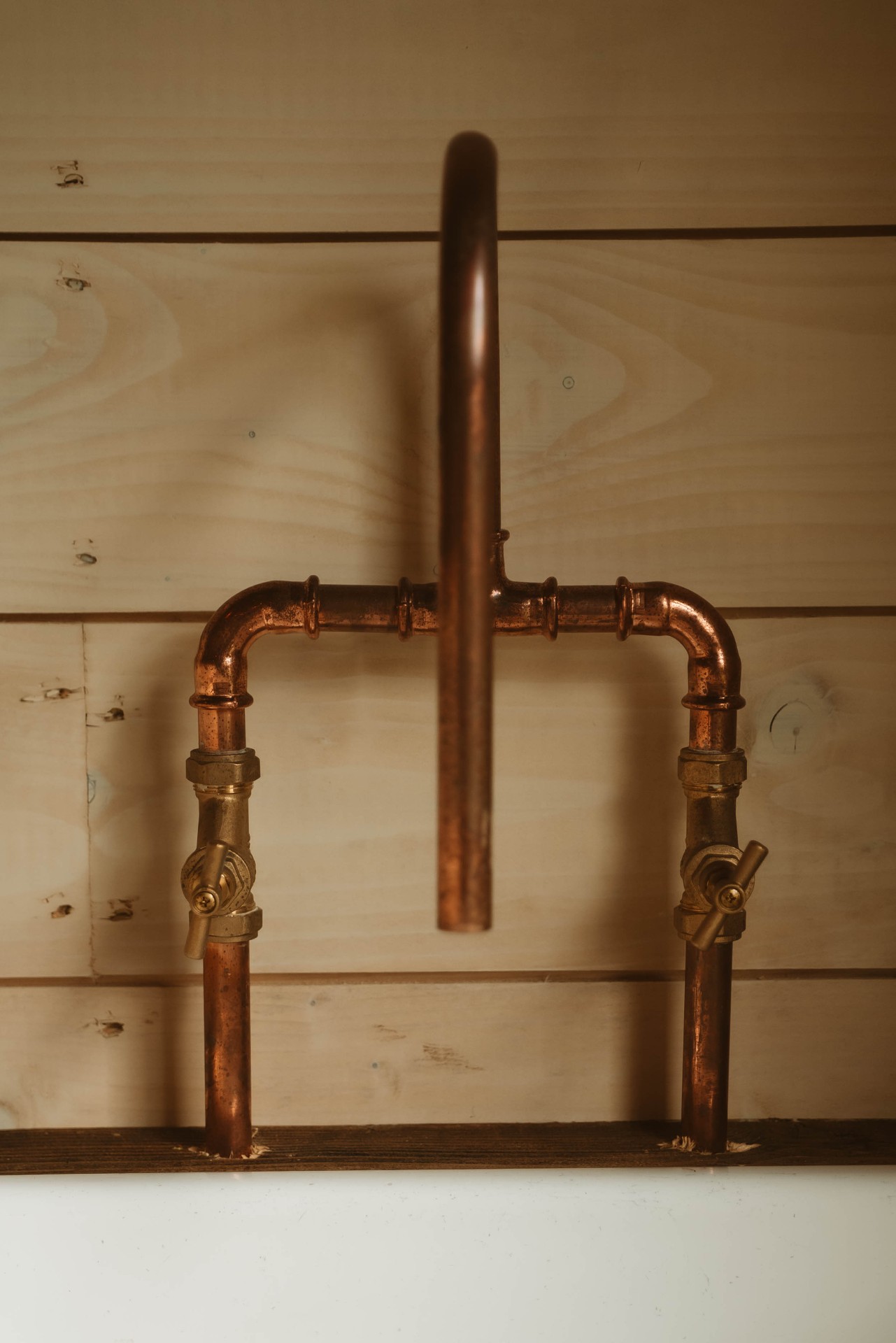 Treehouse Lookout bespoke copper pipe tap detail against timber cladding