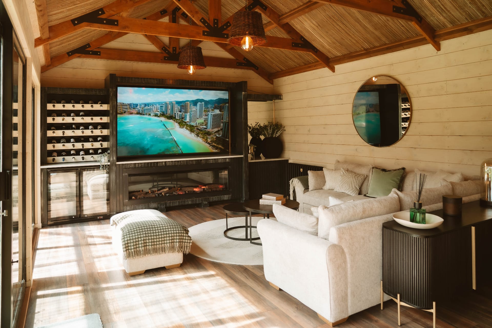 Treehouse Lookout sun-drenched lounge with wine wall, fireplace and sectional sofa
