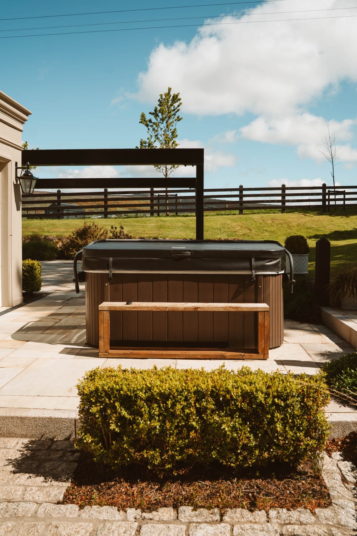 Hot tub terrace with fenced paddock and Sperrin views