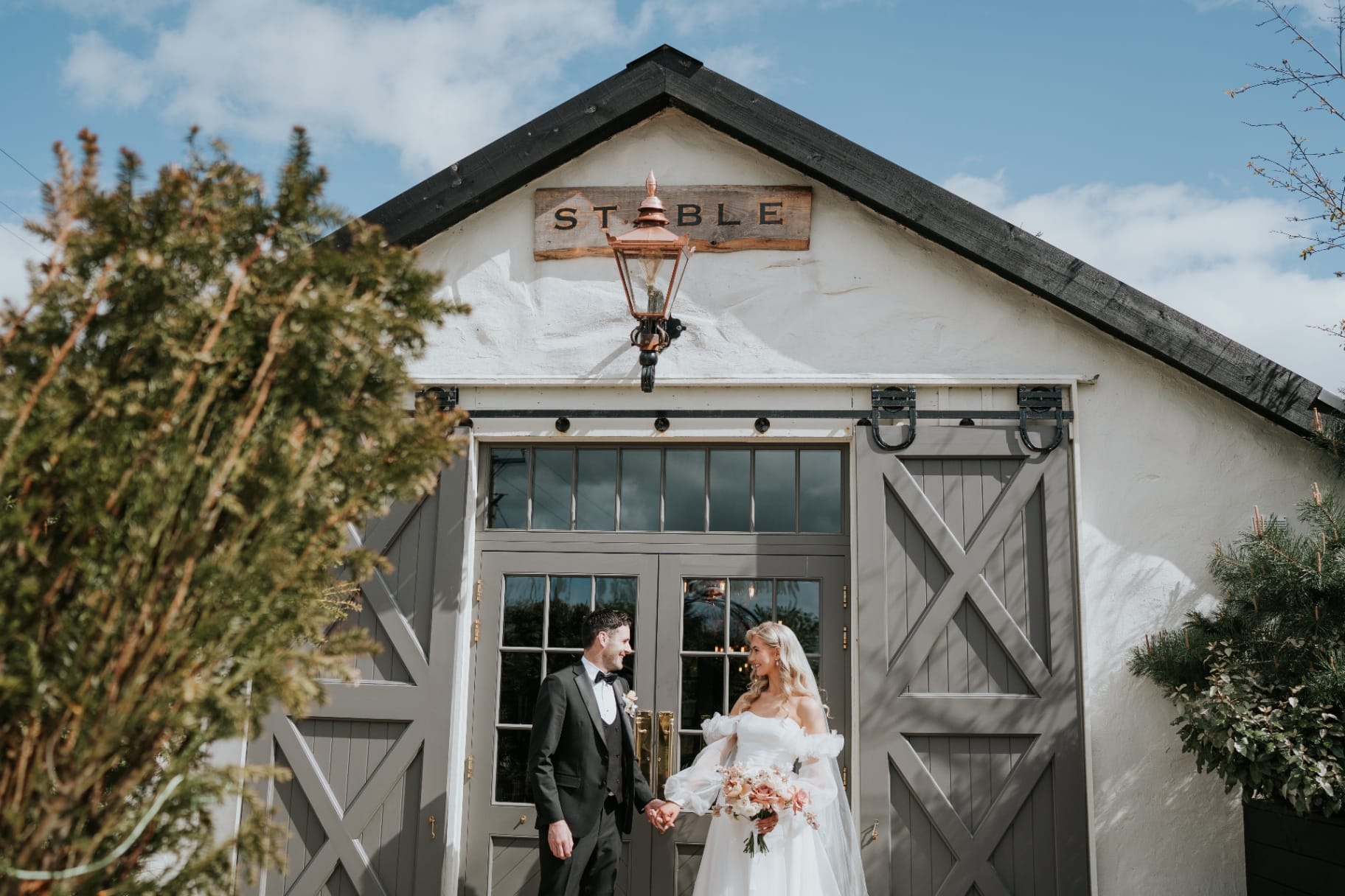 Bride and groom outside The Stable entrance