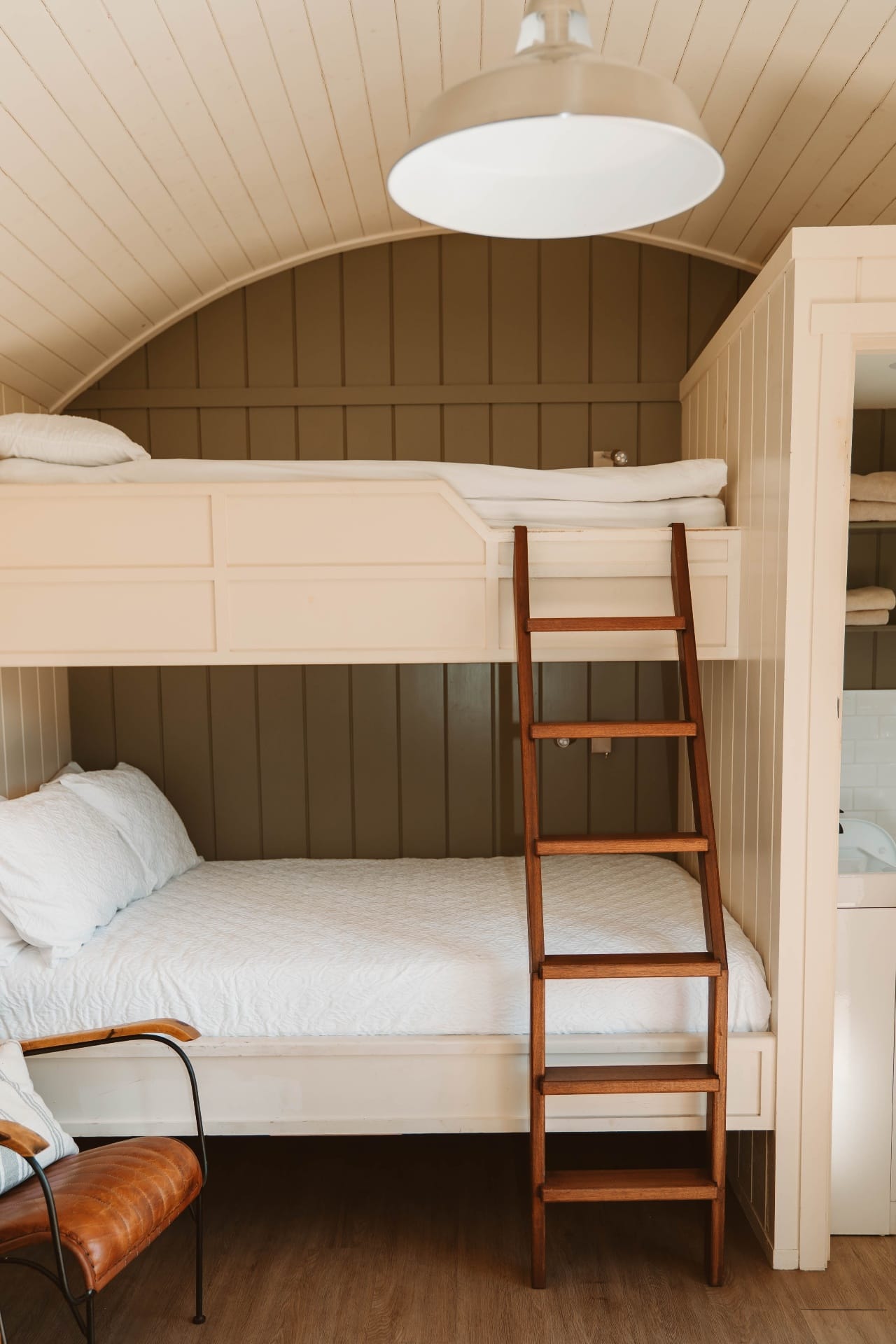 Close-up of Shepherd's Hut bunk beds with arched ceiling detail