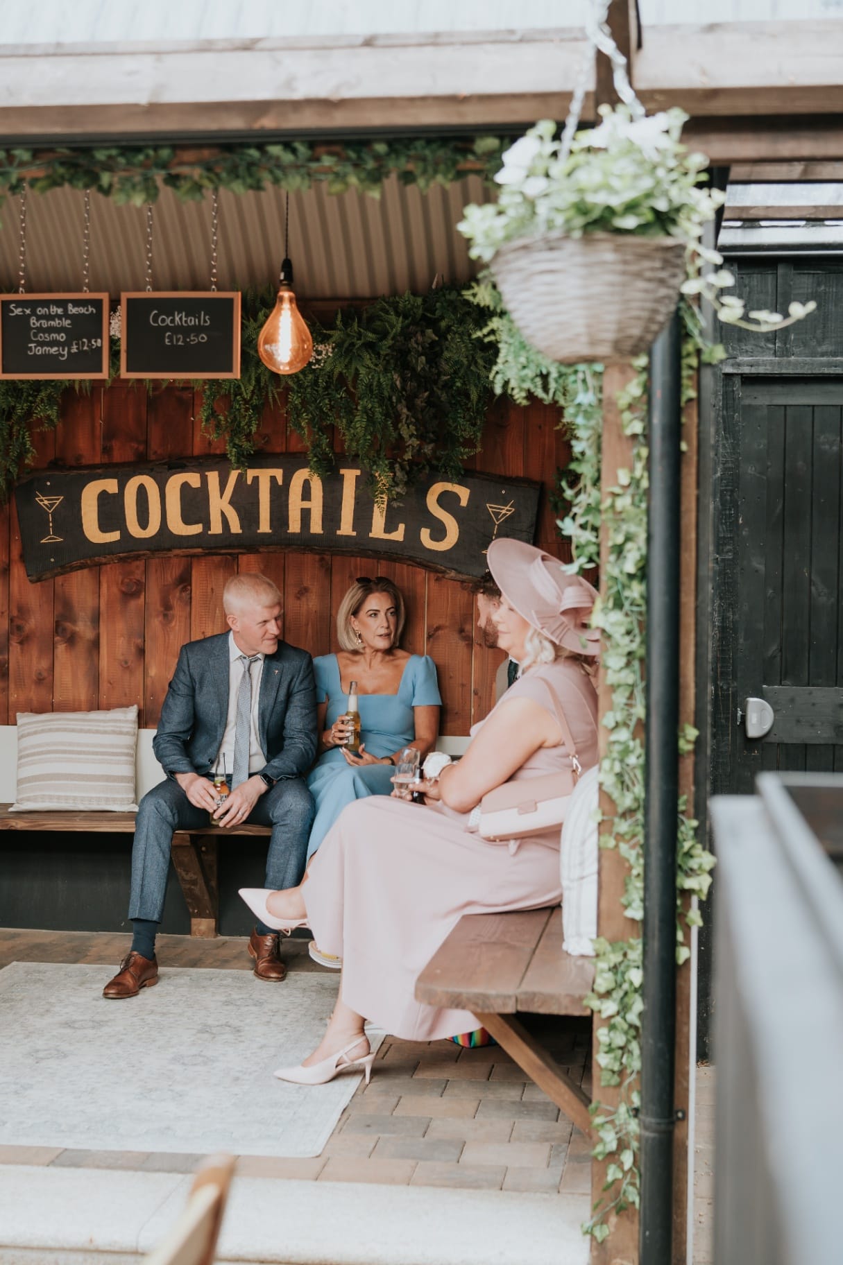 Guests seated in the cocktails nook during the wedding reception