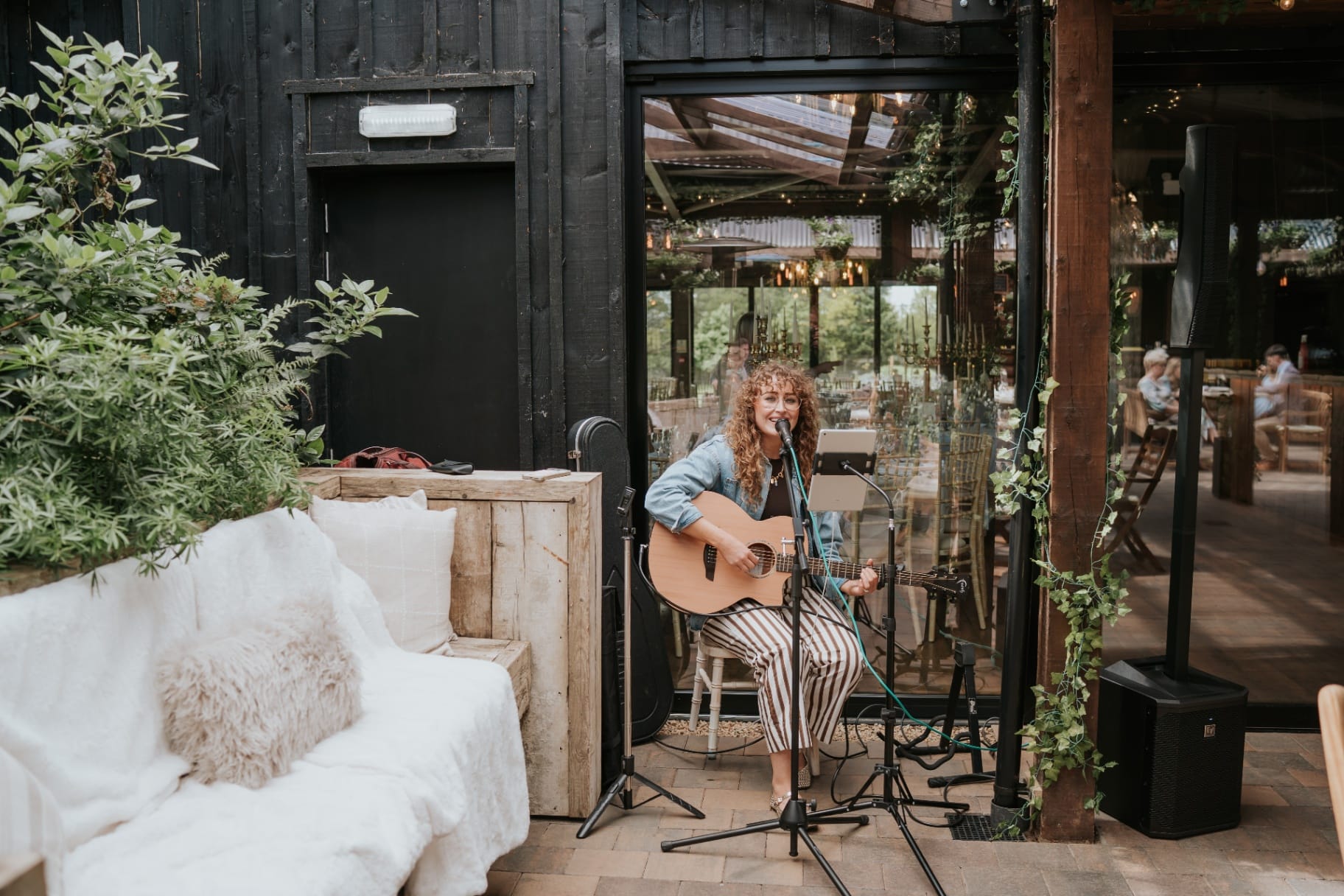 Acoustic singer performing on the courtyard pergola