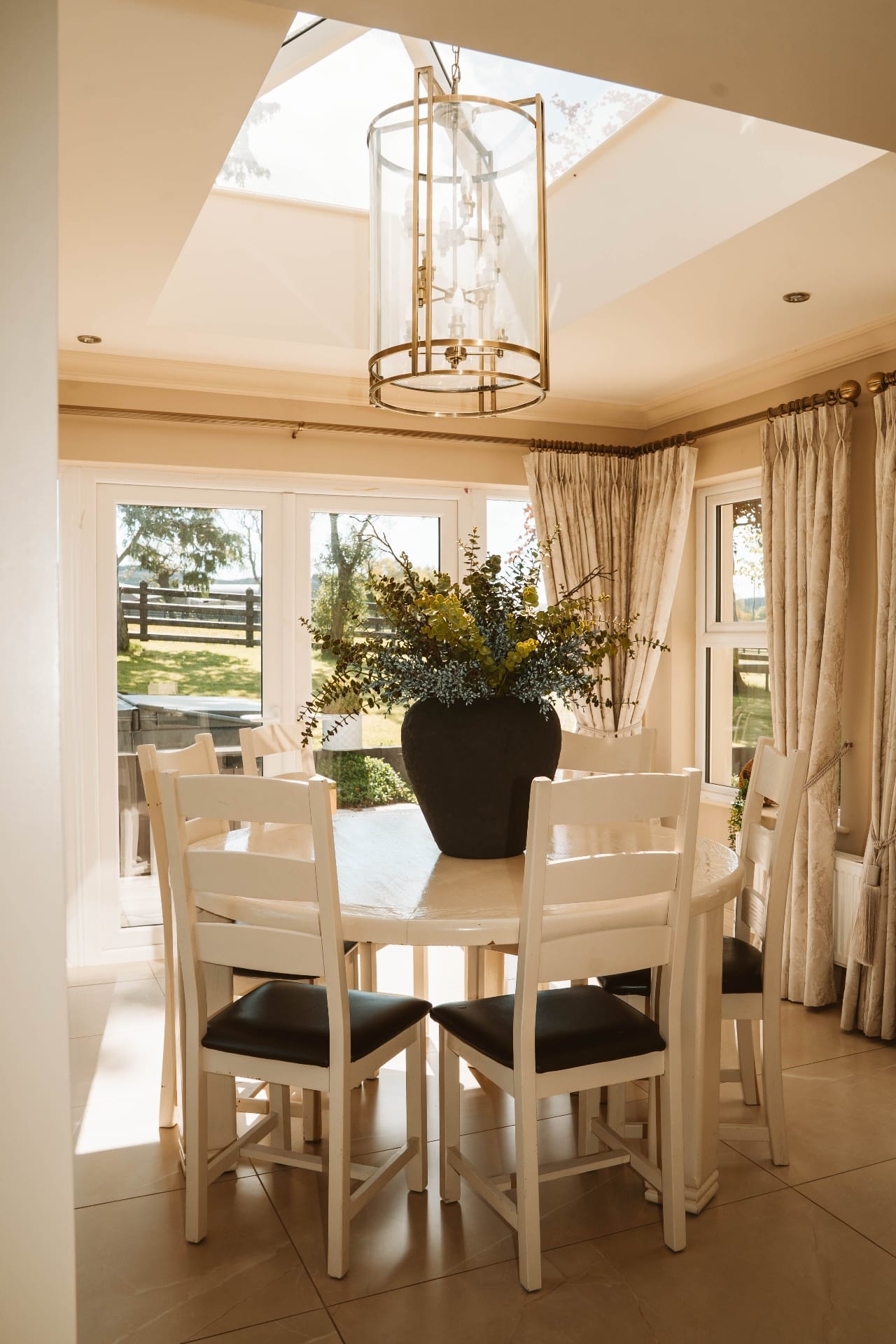 Farmhouse dining room under the lantern skylight